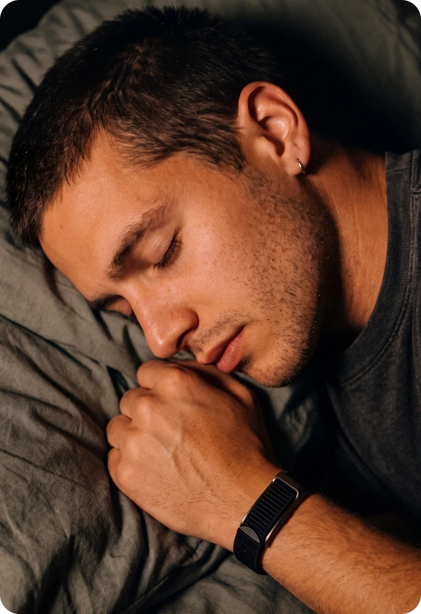 James asleep, wearing the HLTH Band