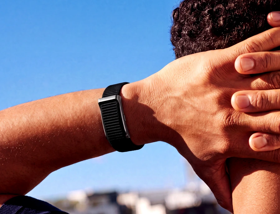 James resting after exercise, wearing the HLTH Band